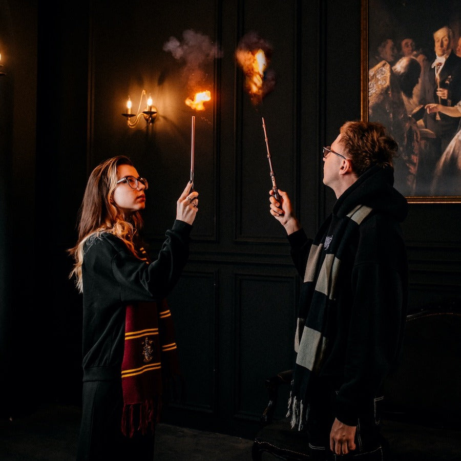 Two friends casting real fireballs with fire magic wands