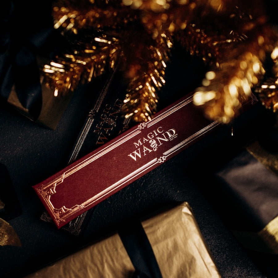 Fire magic wand gift box among wrapped presents